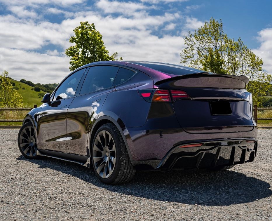 https://redzinimotorsports.com/cdn/shop/files/Tesla-Model-Y-Rear-Diffuser-Gloss-Black-Back-Left.jpg?v=1700352130&width=3840